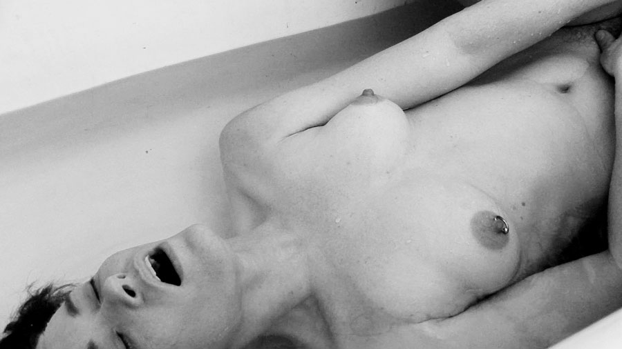 Genderqueer porn star Jiz Lee naked and masturbating in a bathtub in this award winning film